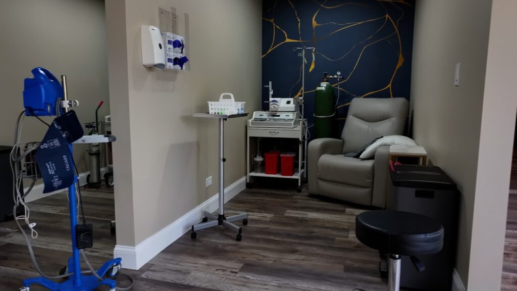 EBOO therapy treatment room with medical equipment and comfortable recliner at 369 Wellness Center, Northfield IL.